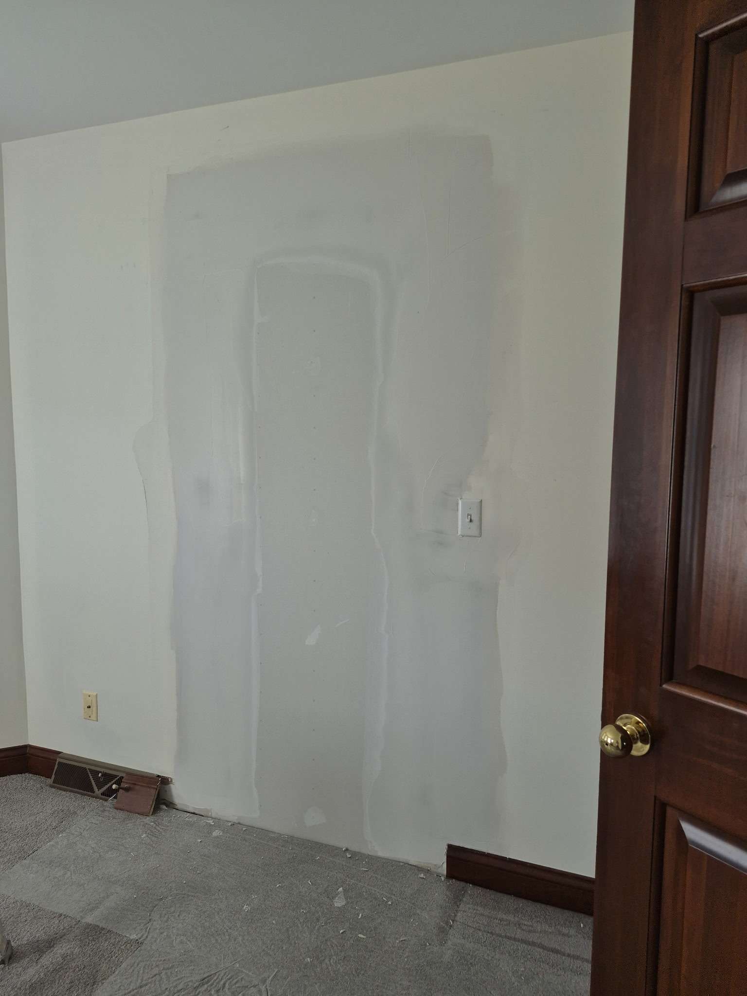 Door replaced with drywall